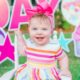 Adorable baby smiling on a white chair